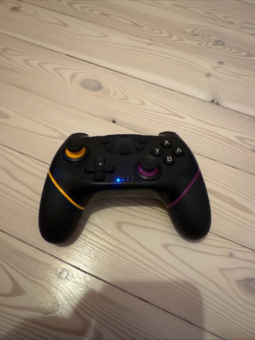 Wireless Black Game Controller with Yellow & Purple Accents